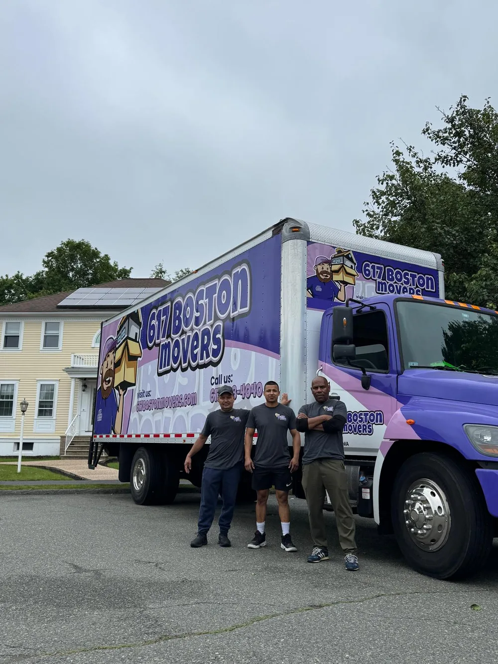 617 Boston Movers crew standing beside a moving truck