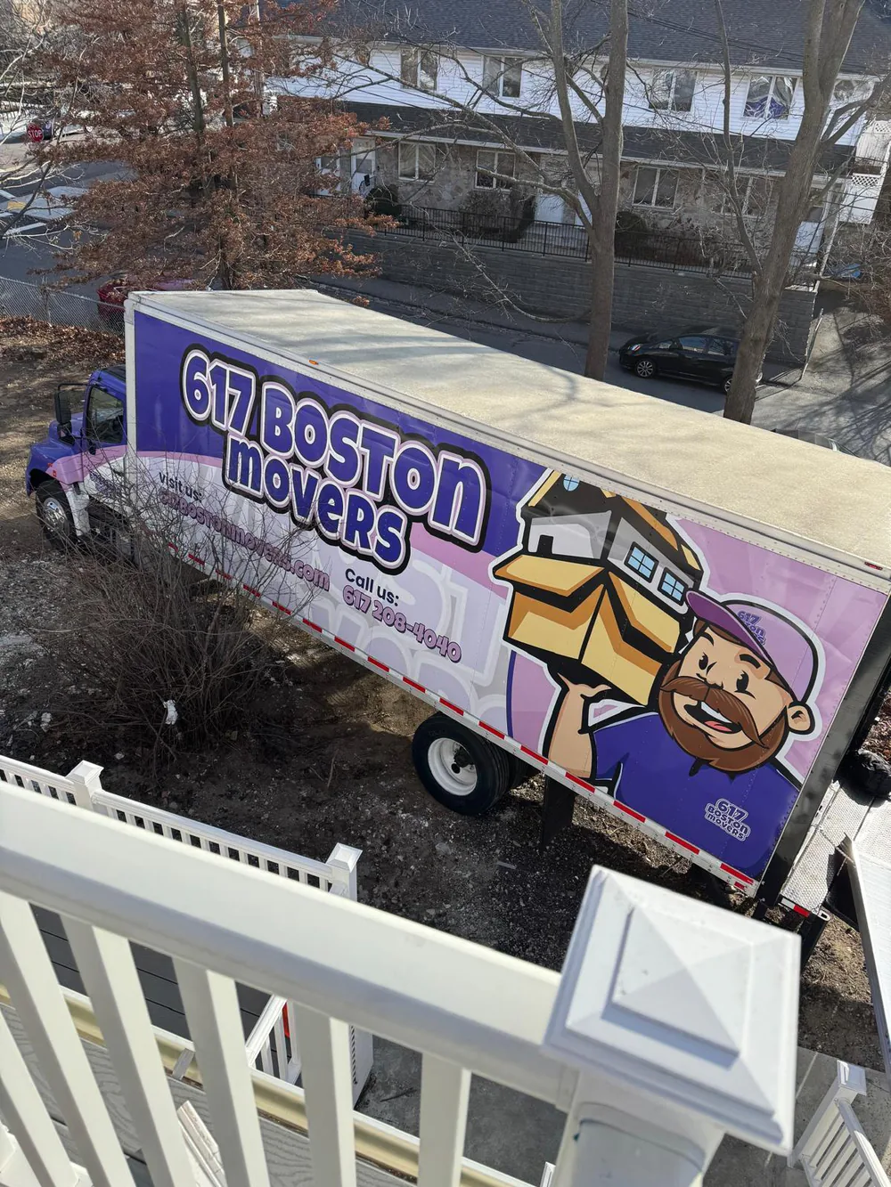 617 Boston Movers truck viewed from a balcony