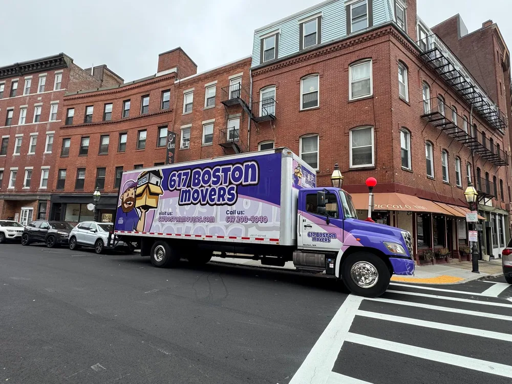617 Boston Movers truck parked on a Boston street