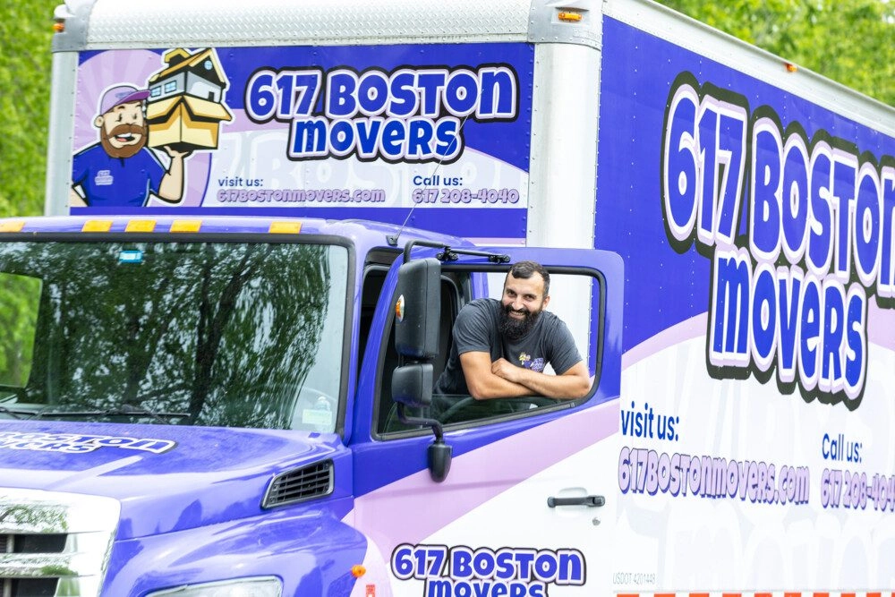 Friendly Boston mover in a moving truck